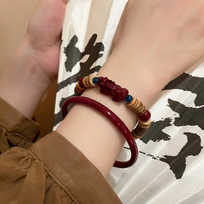 Earth & Ember Collection | Artisan Cinnabar Bangle & Hand-Carved Coconut Shell Pixiu Bracelet Set