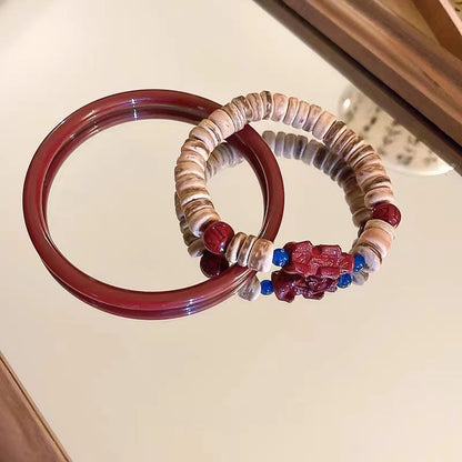 Earth & Ember Collection | Artisan Cinnabar Bangle & Hand-Carved Coconut Shell Pixiu Bracelet Set